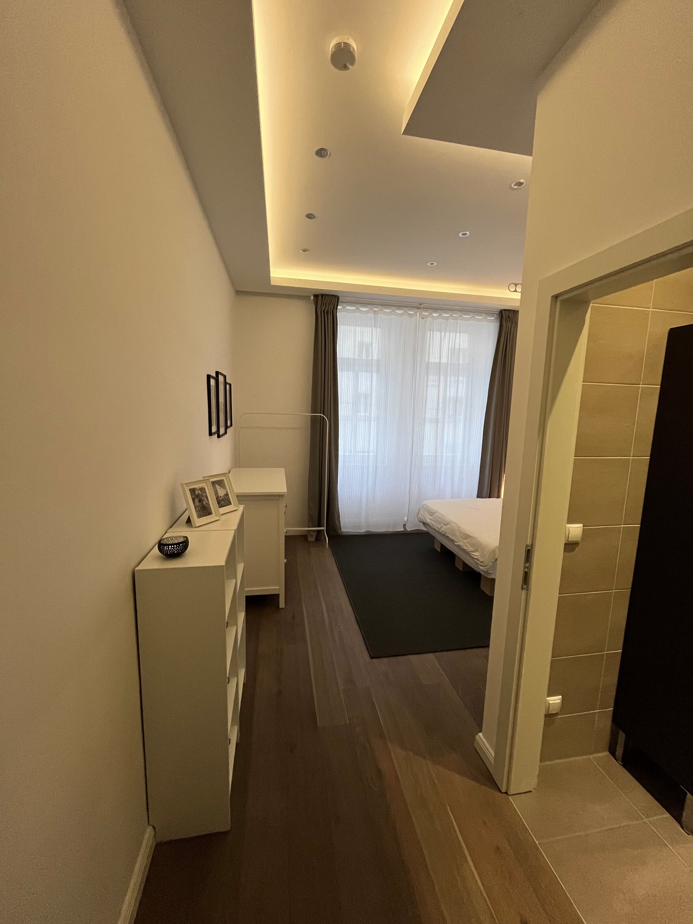 View towards the bedroom with entrance to the bathroom