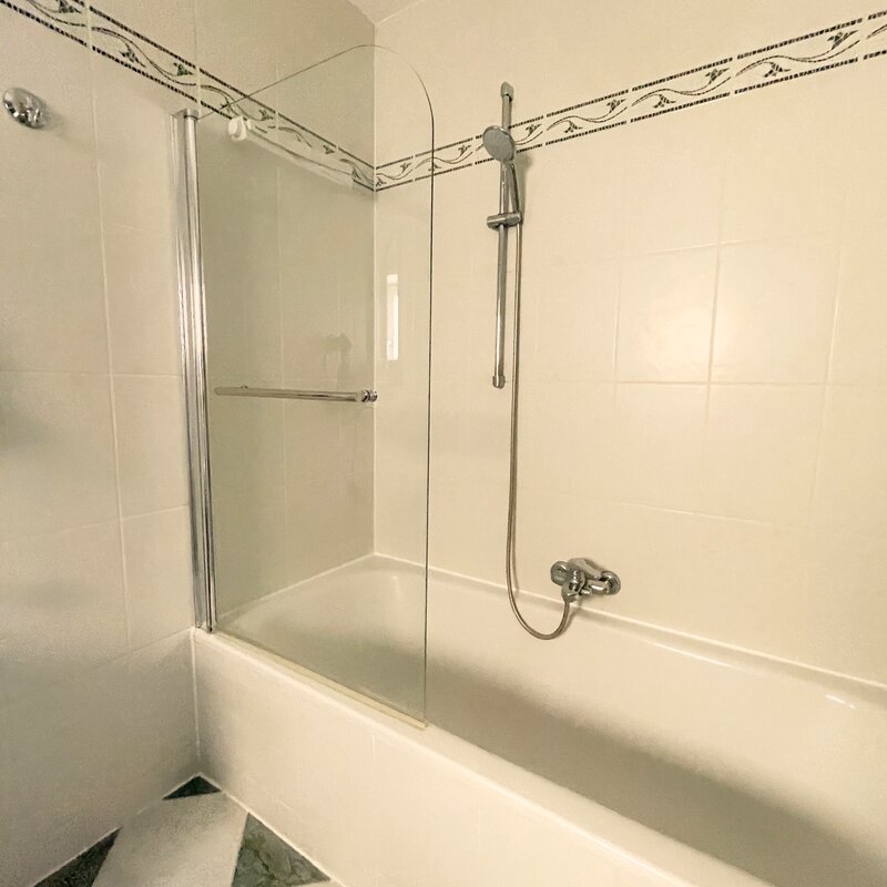 bathtub with overhead shower