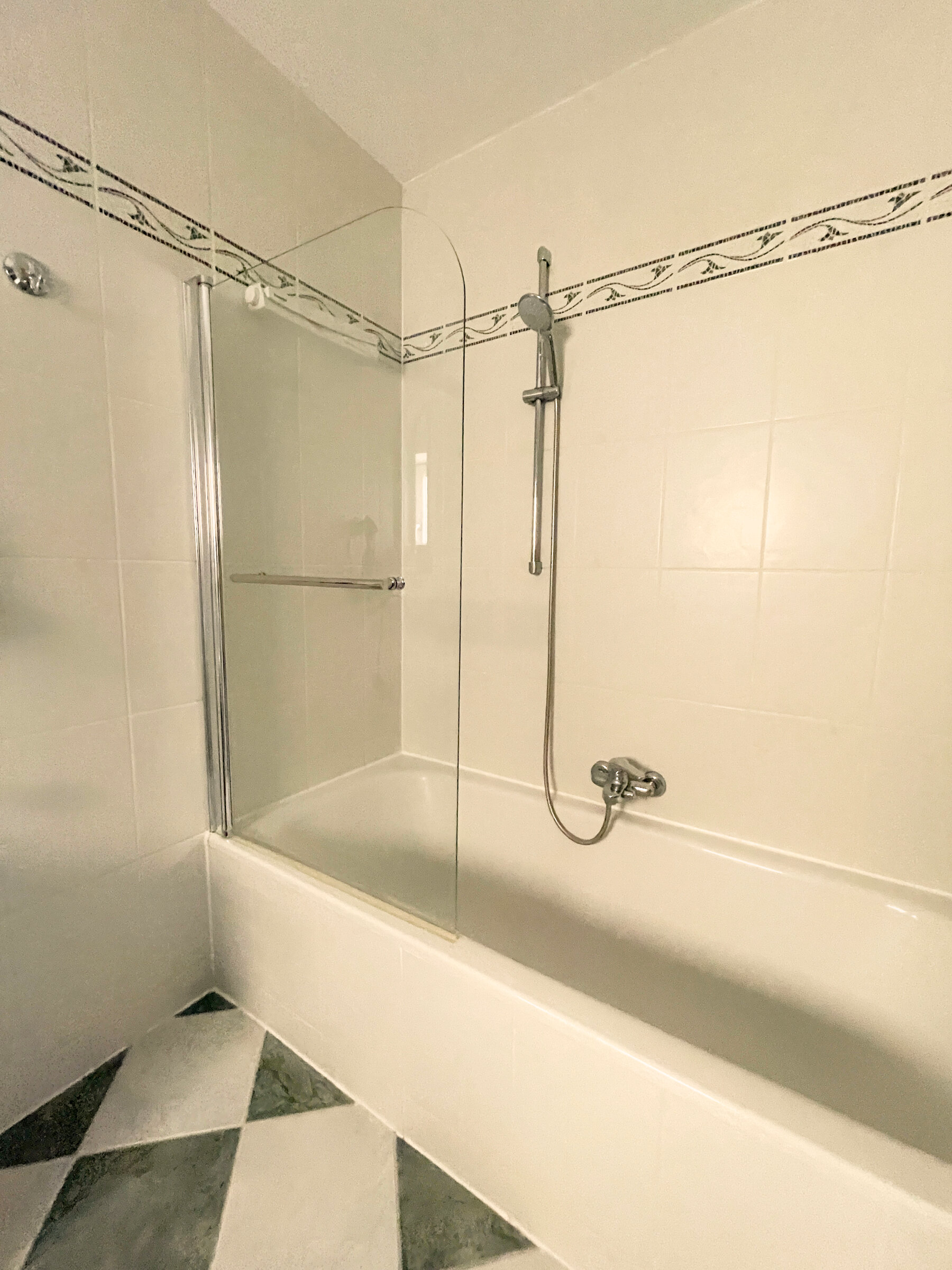 bathtub with overhead shower