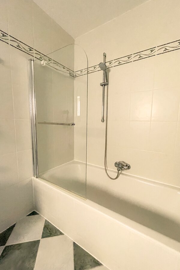 bathtub with overhead shower