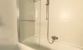 bathtub with overhead shower