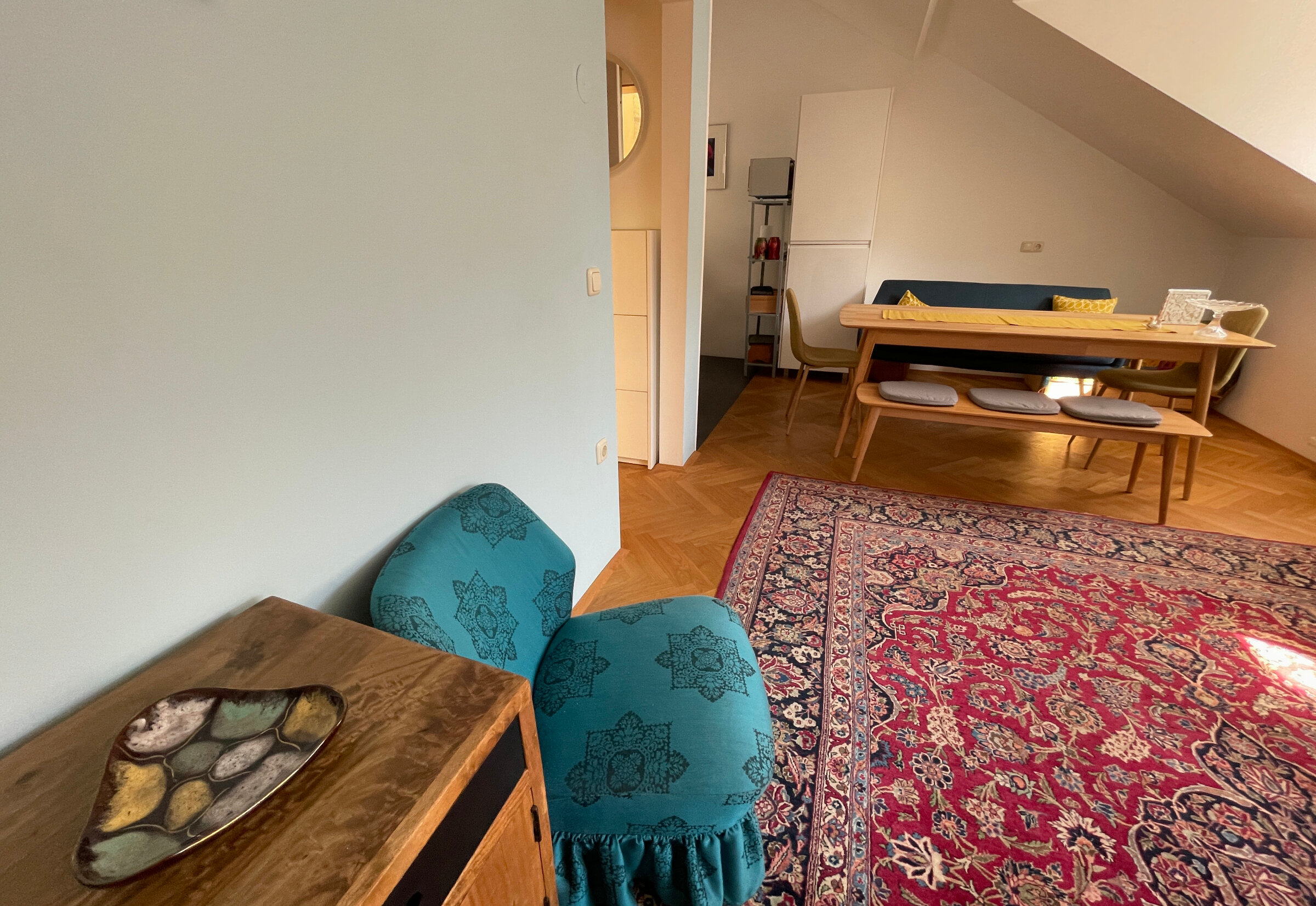 The flat is furnished using both modern and vintage furniture.