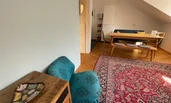 The flat is furnished using both modern and vintage furniture.