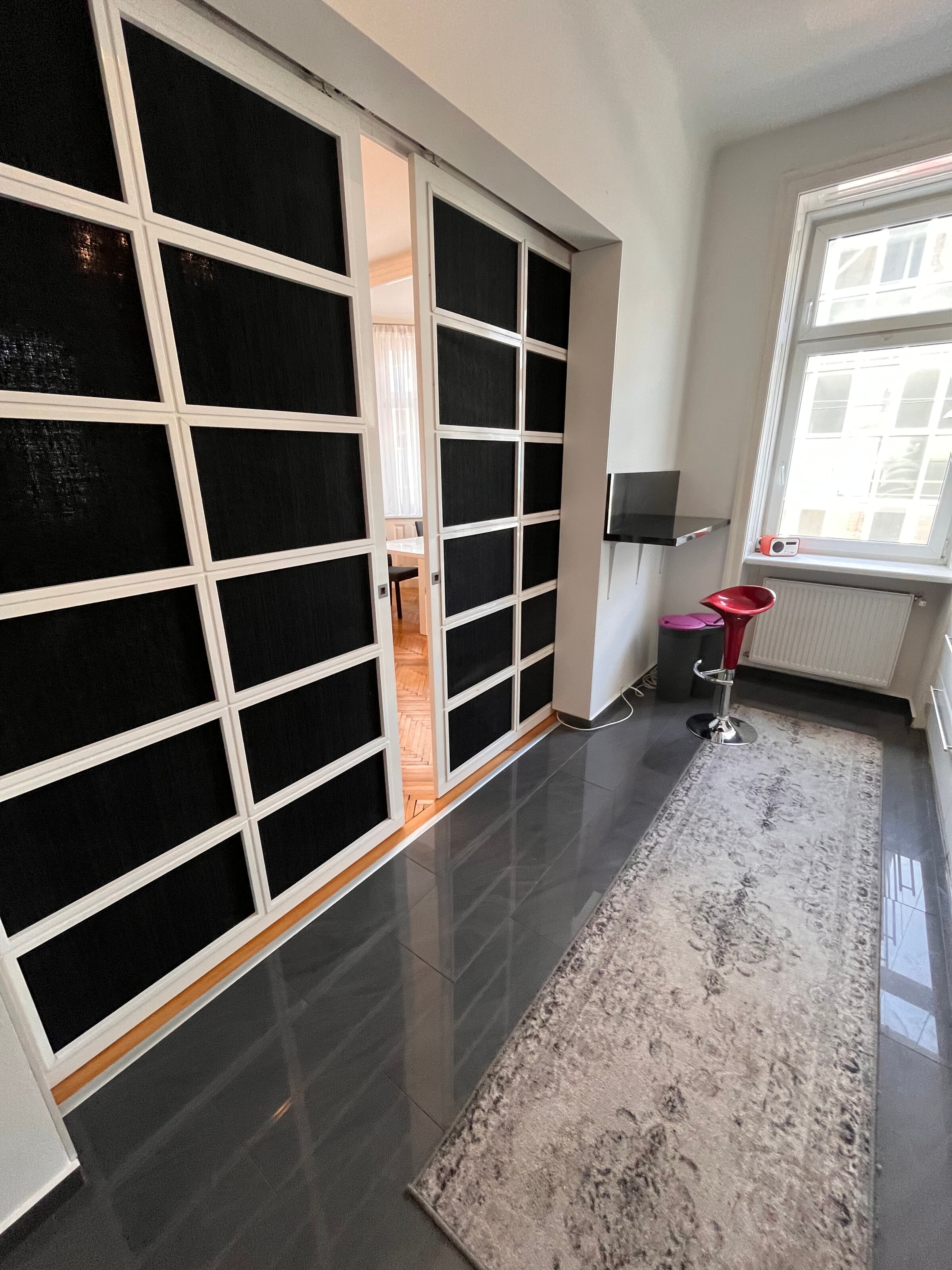 Sliding door between kitchen and living room