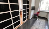 Sliding door between kitchen and living room