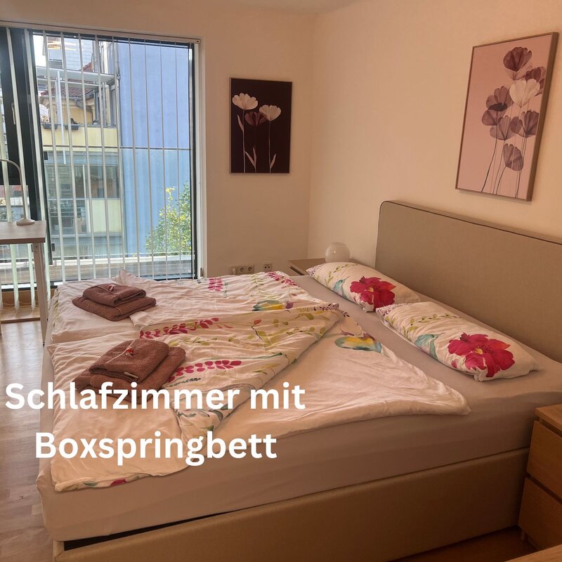 Bedroom with box spring bed