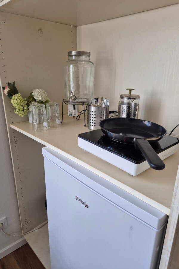 Small kitchenette in the room, without water supply 