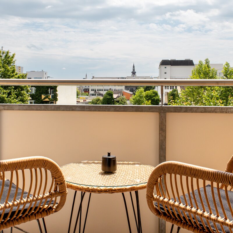 Sunny balcony with a view of the city