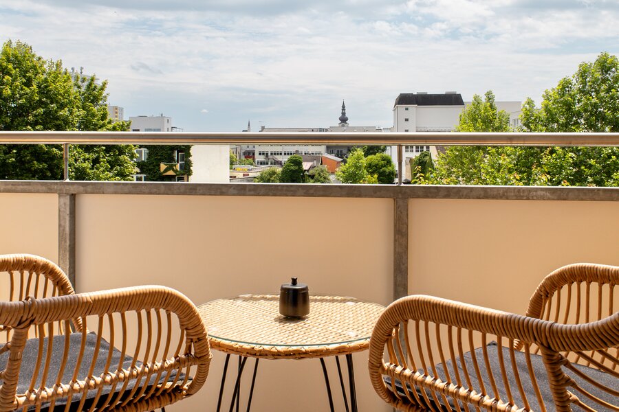 Sunny balcony with a view of the city
