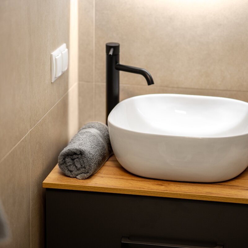 Stylish bathroom with towels and free toiletries