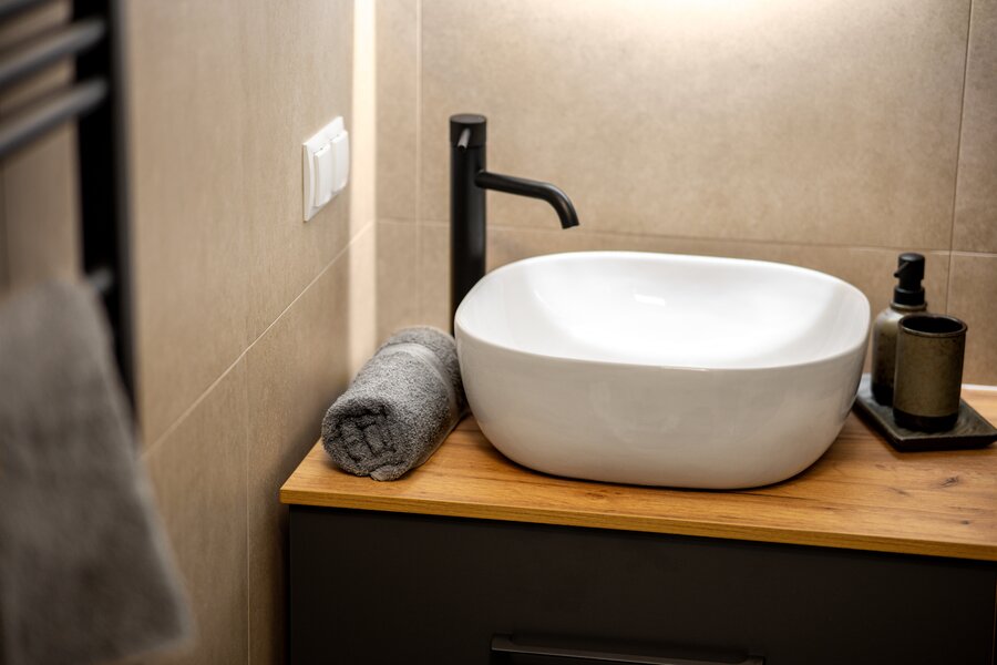 Stylish bathroom with towels and free toiletries