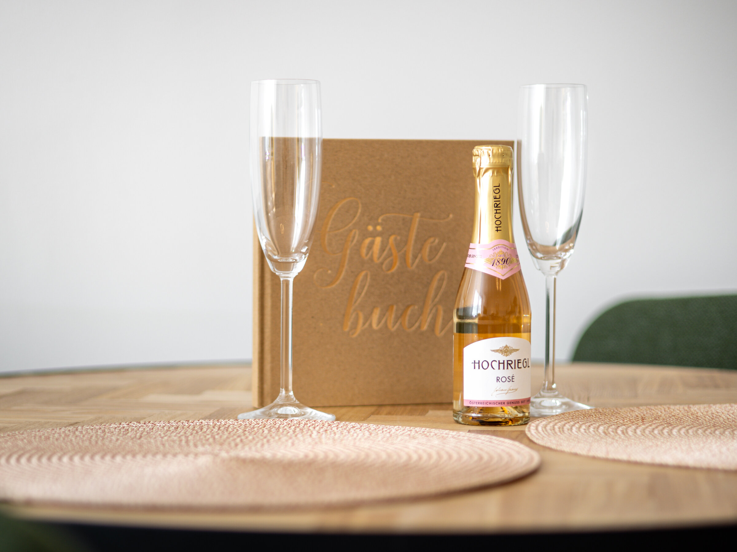 Welcome gift with champagne bottle and guest book
