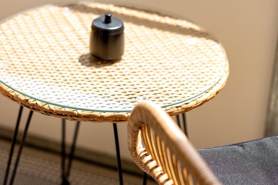 Outdoor dining area on the sunny balcony