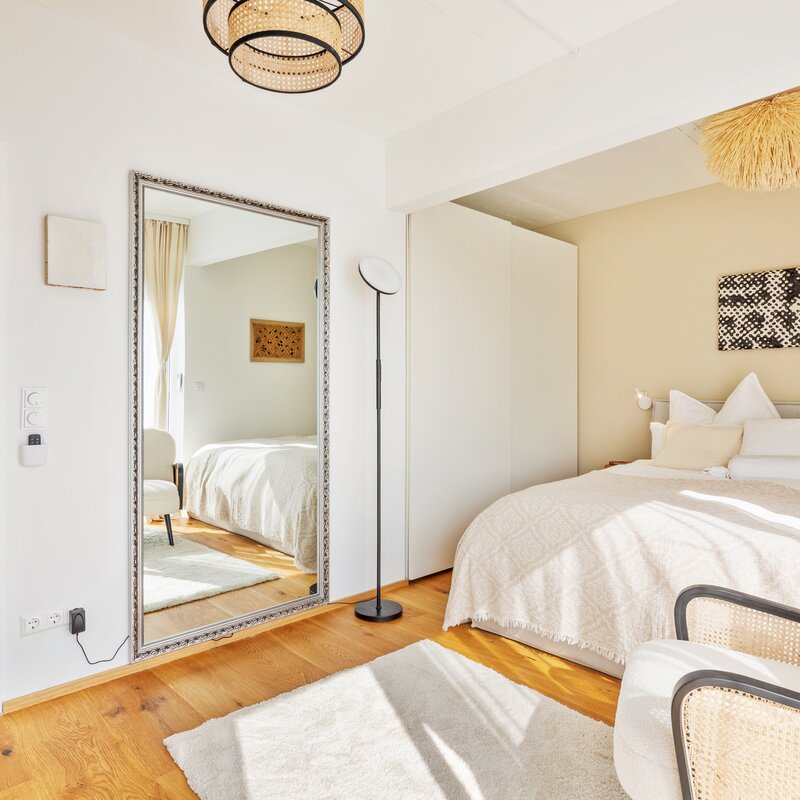 Bedroom with door to the hallway and bathroom