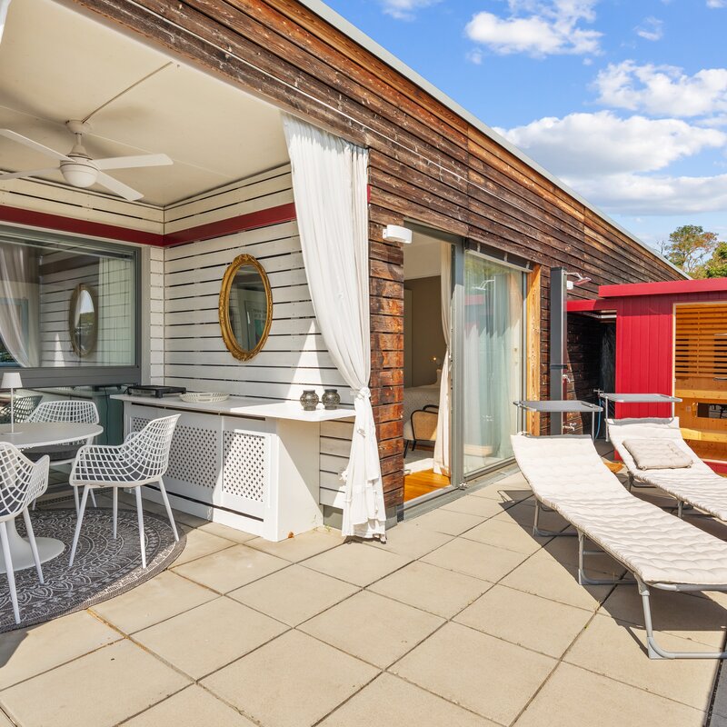 terrace with loggia and outdoor dining, grill, sauna and entrance to the bedroom