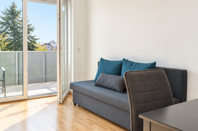Bright living room with balcony – 2-room apartment for short-term rental & temporary housing for 1 to 6 months in Graz