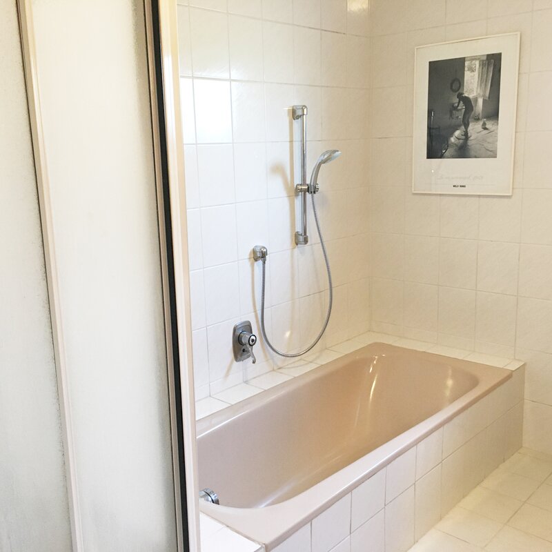 Bathroom with shower and bathtub