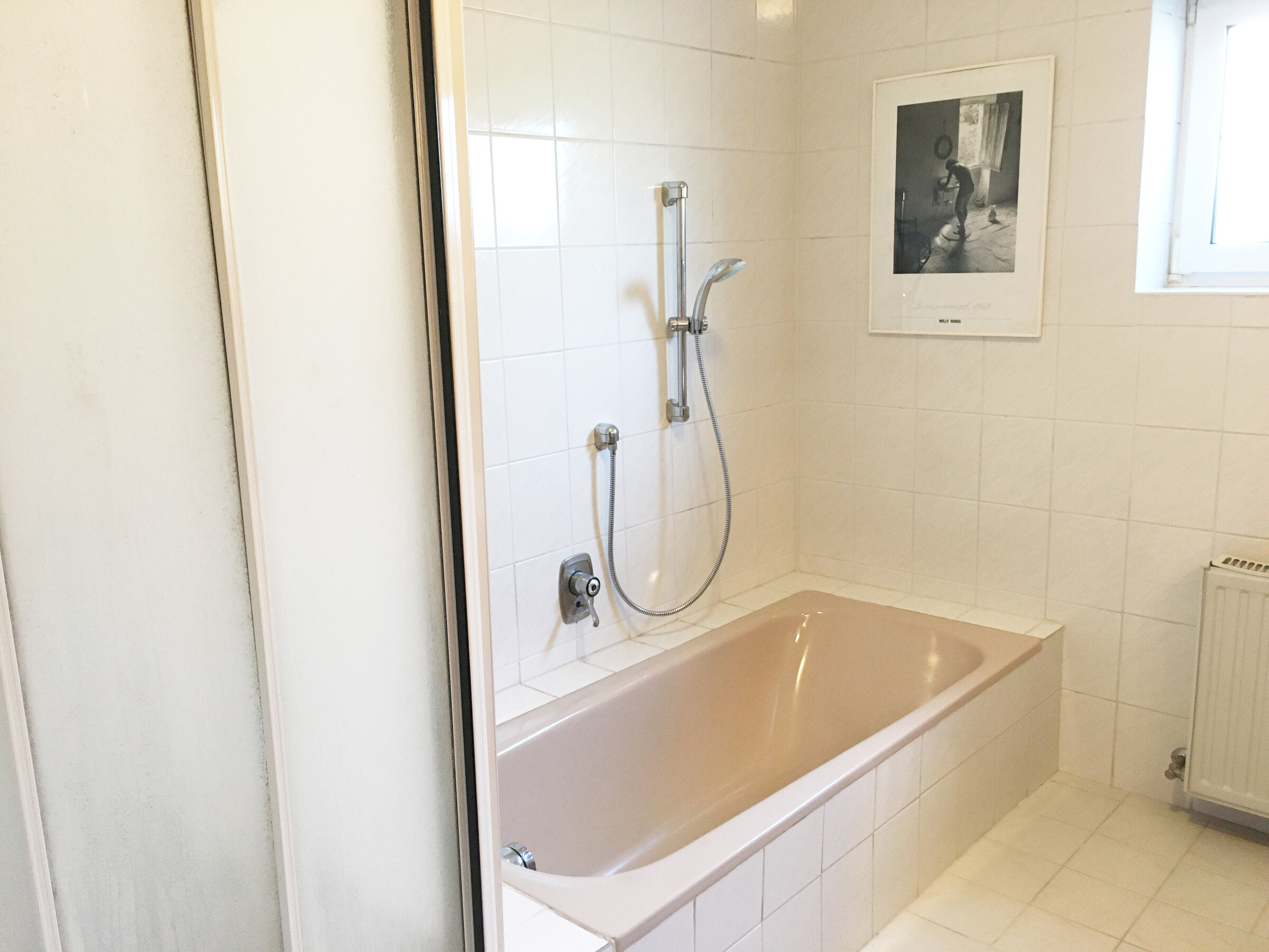 Bathroom with shower and bathtub
