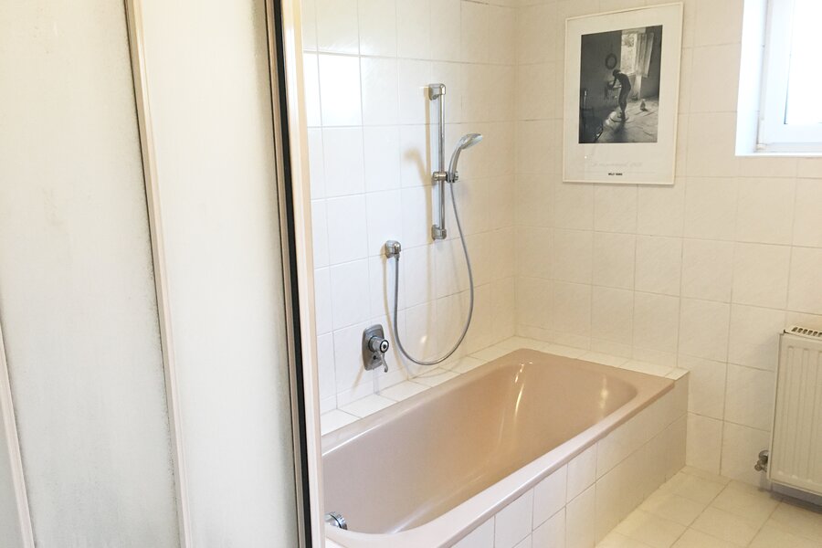 Bathroom with shower and bathtub