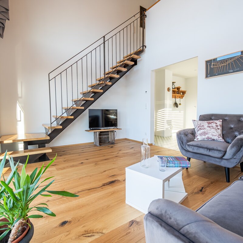 Living Room, view to stairs leading to the bed room