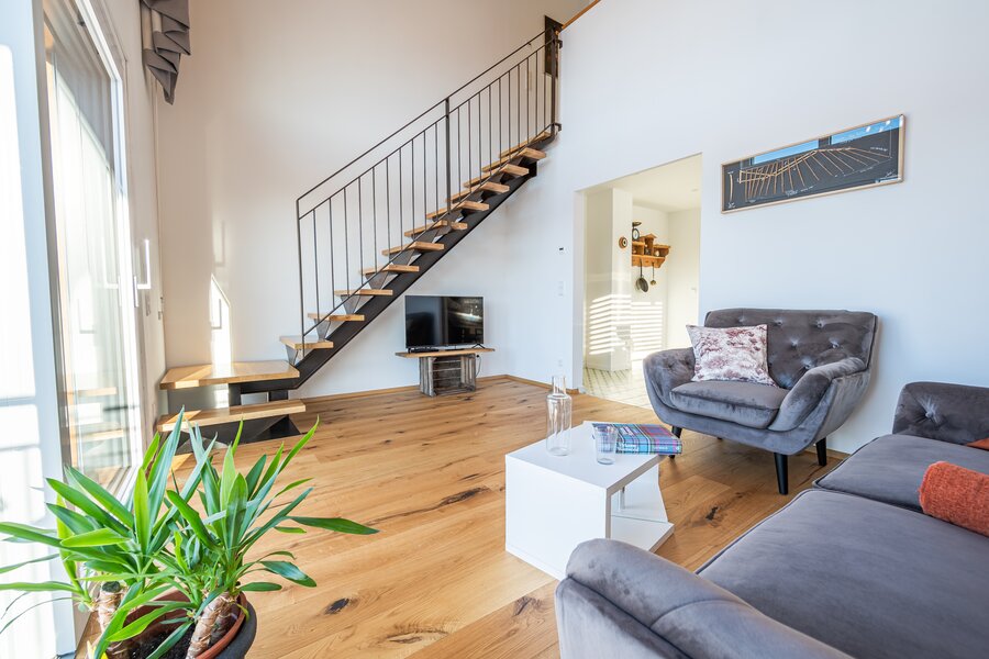 Living Room, view to stairs leading to the bed room