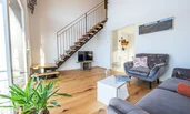 Living Room, view to stairs leading to the bed room