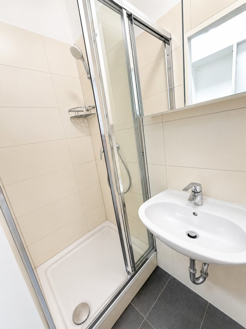 Well-maintained bathroom with shower and toilet.