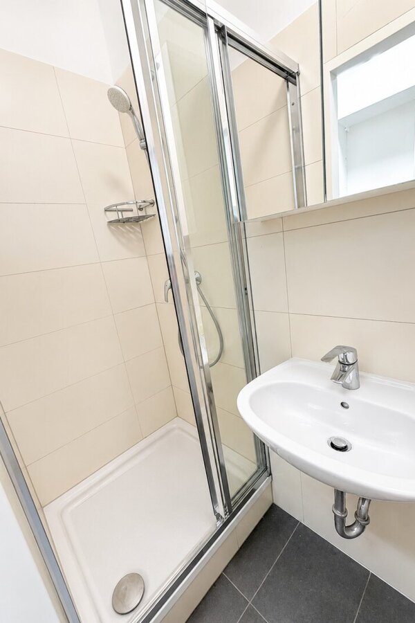 Well-maintained bathroom with shower and toilet.