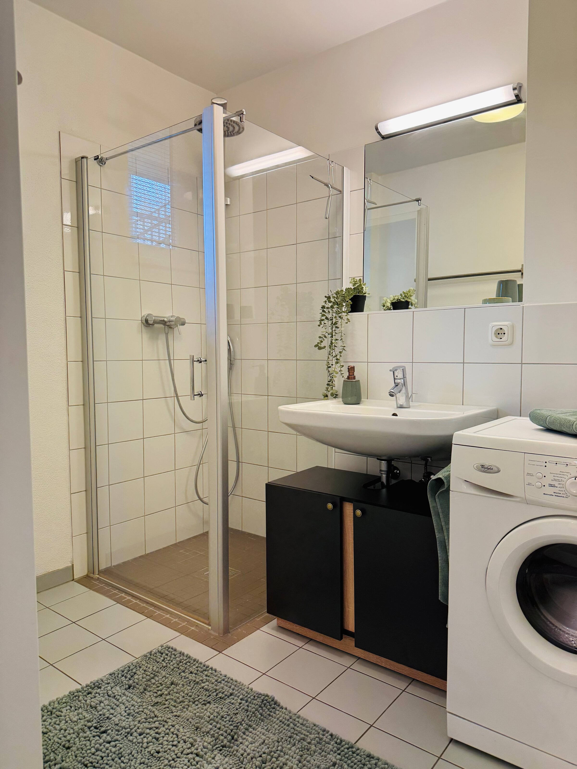 with large shower and washing machine