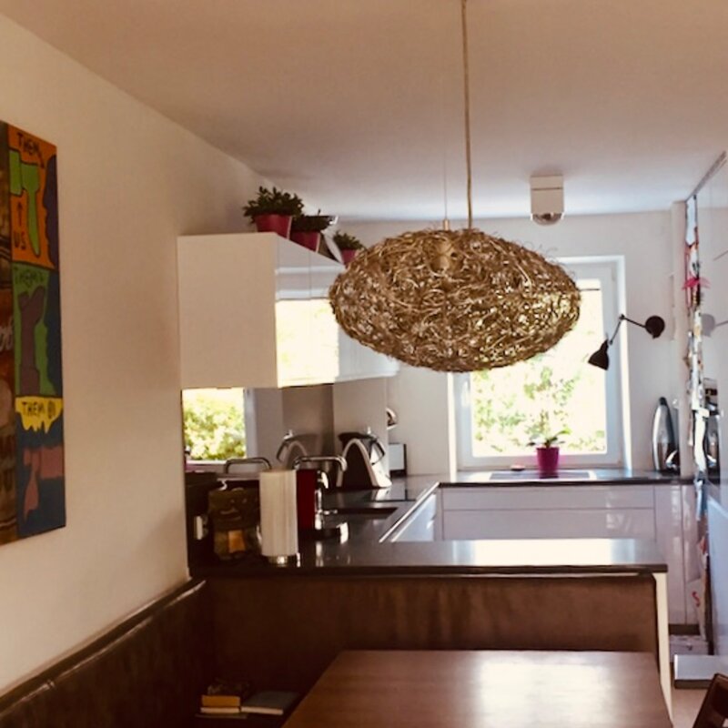 When you seat at the dinning table and view the kitchen