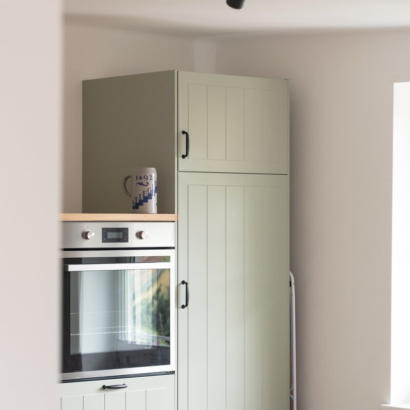 New oven and tall refrigerator including freezer compartment