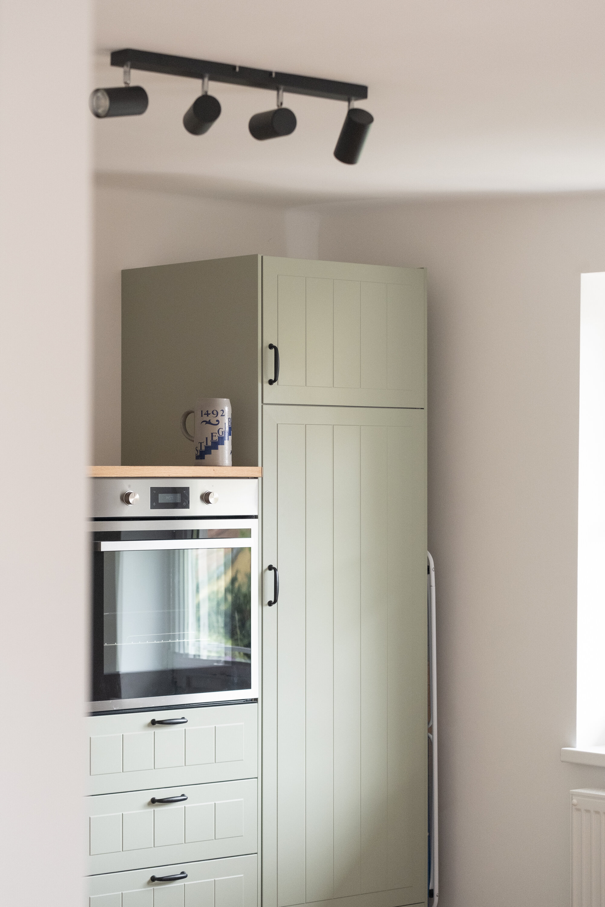 New oven and tall refrigerator including freezer compartment