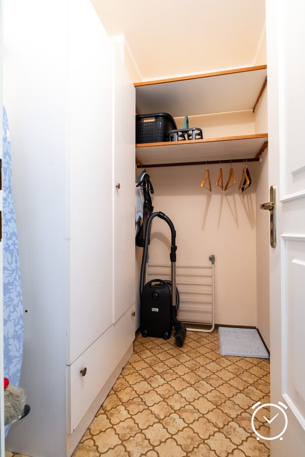 Useful storage room with shelves and clothes rail. Ideal for storing household appliances and seasonal clothing.