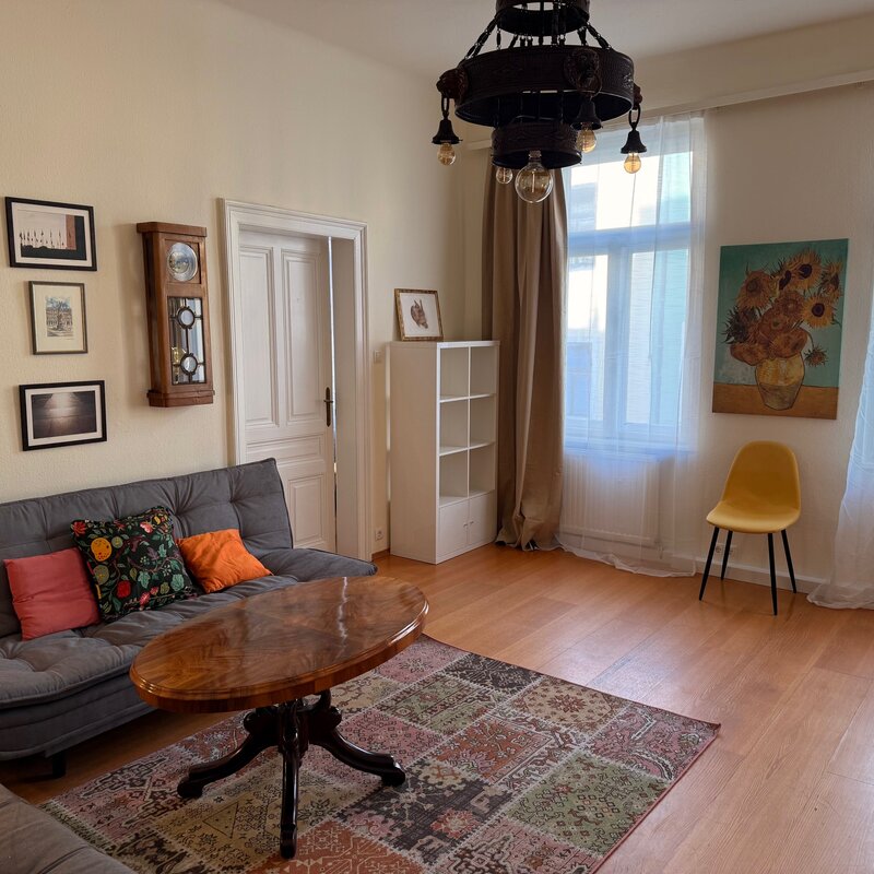 Bright living room with parquet & vintage charm – 2-room apartment for short-term rental & temporary housing for 1 to 6 months in Vienna
