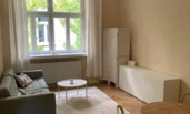 Living room overlooking green courtyard