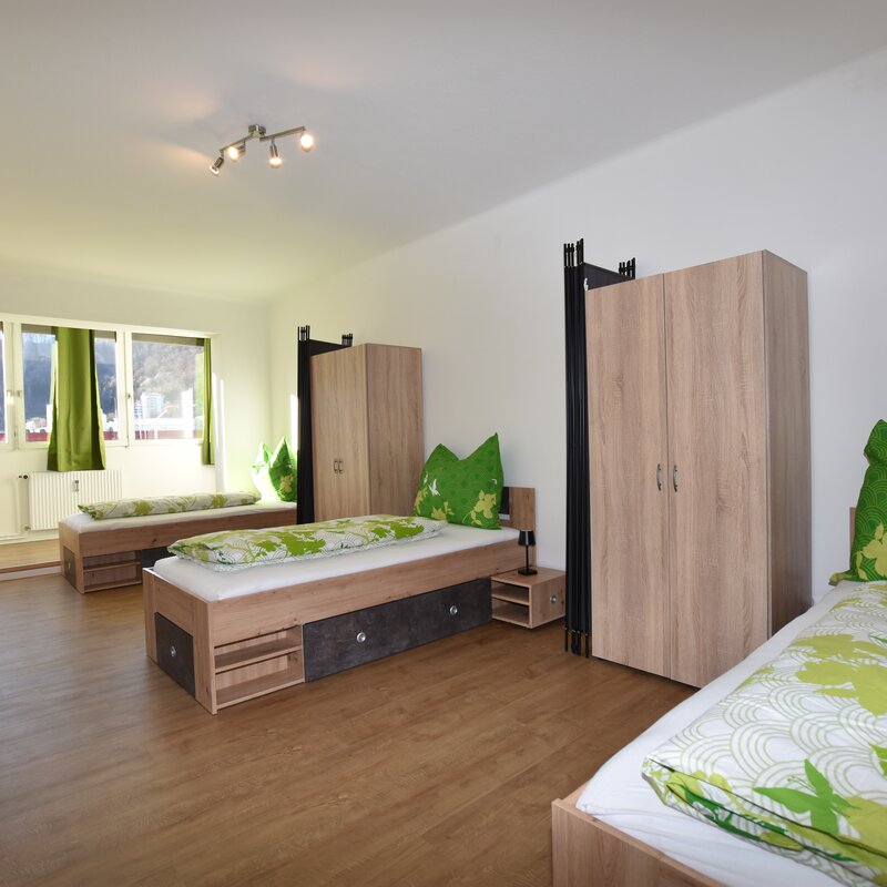 Room with 3 single beds