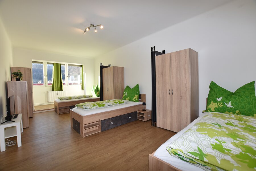 Room with 3 single beds