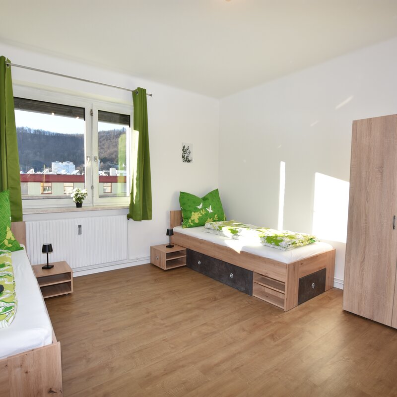 room with 2 single beds