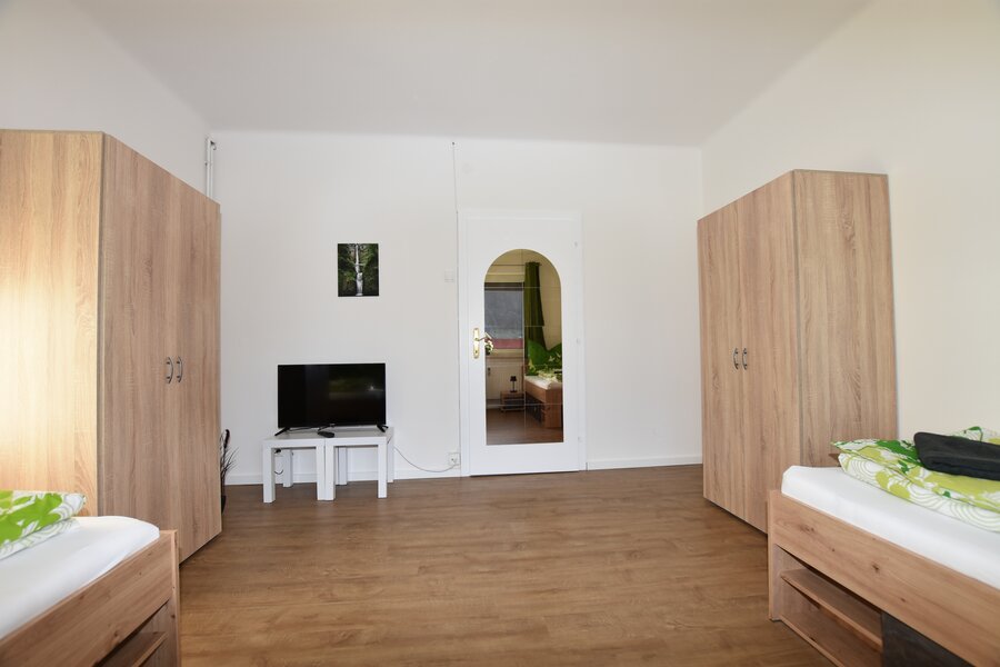 room with 2 single beds