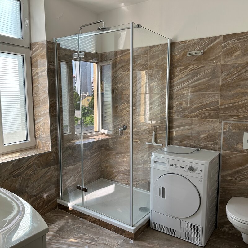 Bathroom with washing machine and dryer