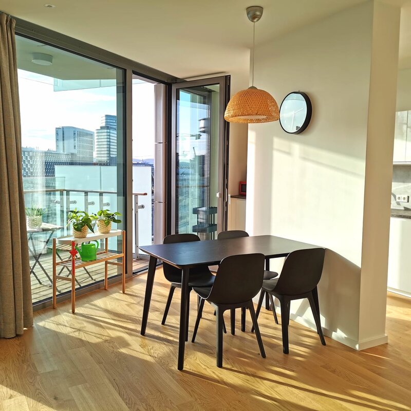 Bright dining area with balcony & city view – 2-room apartment, short-term rental, temporary housing for 1 to 6 months in Vienna