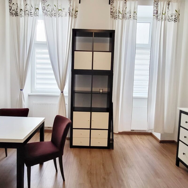 Bright living area with dining table & storage – 1-room apartment, short-term rental & temporary housing for 1 to 6 months in Vienna