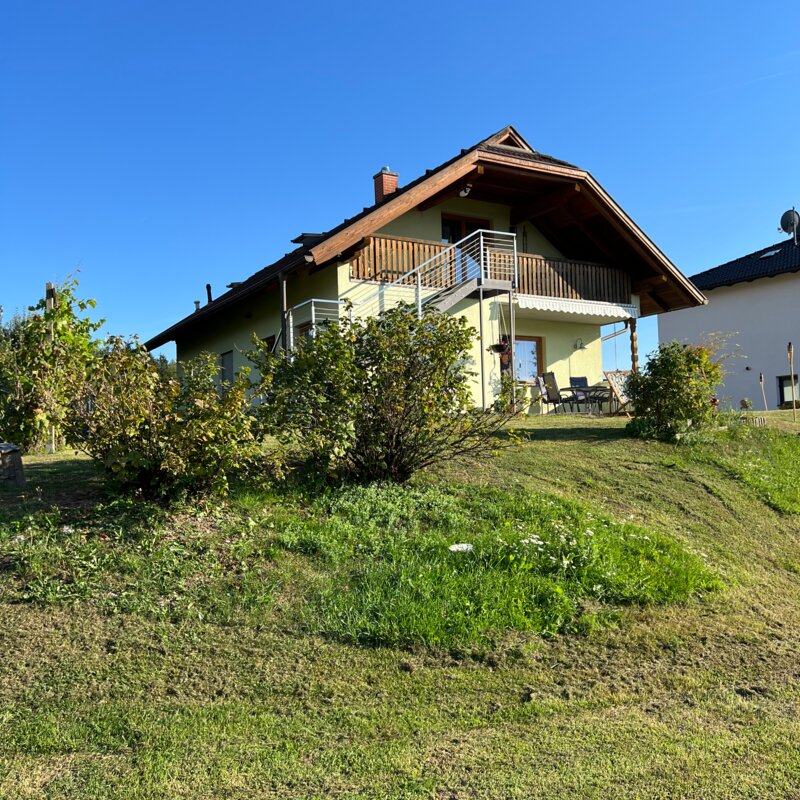 The apartment is located on the upper floor and can be accessed via an outdoor staircase.