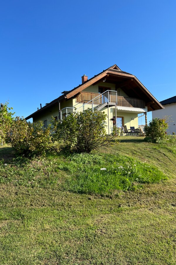 The apartment is located on the upper floor and can be accessed via an outdoor staircase.