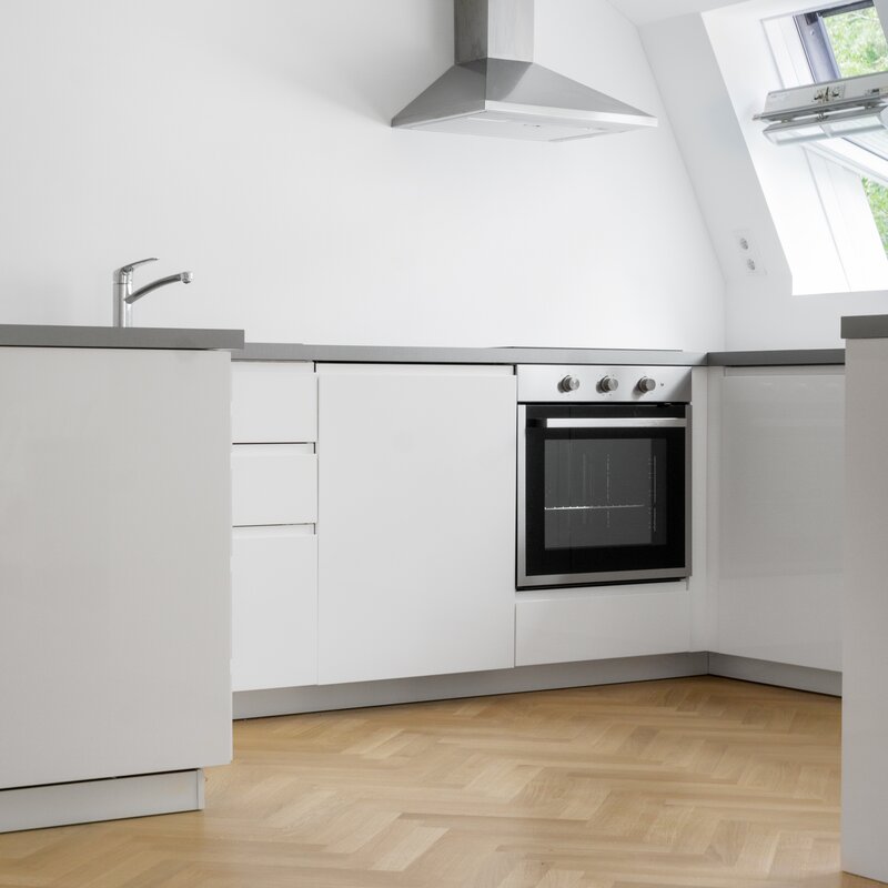 This kitchen is fully integrated into the spacious open living, working and dining area.