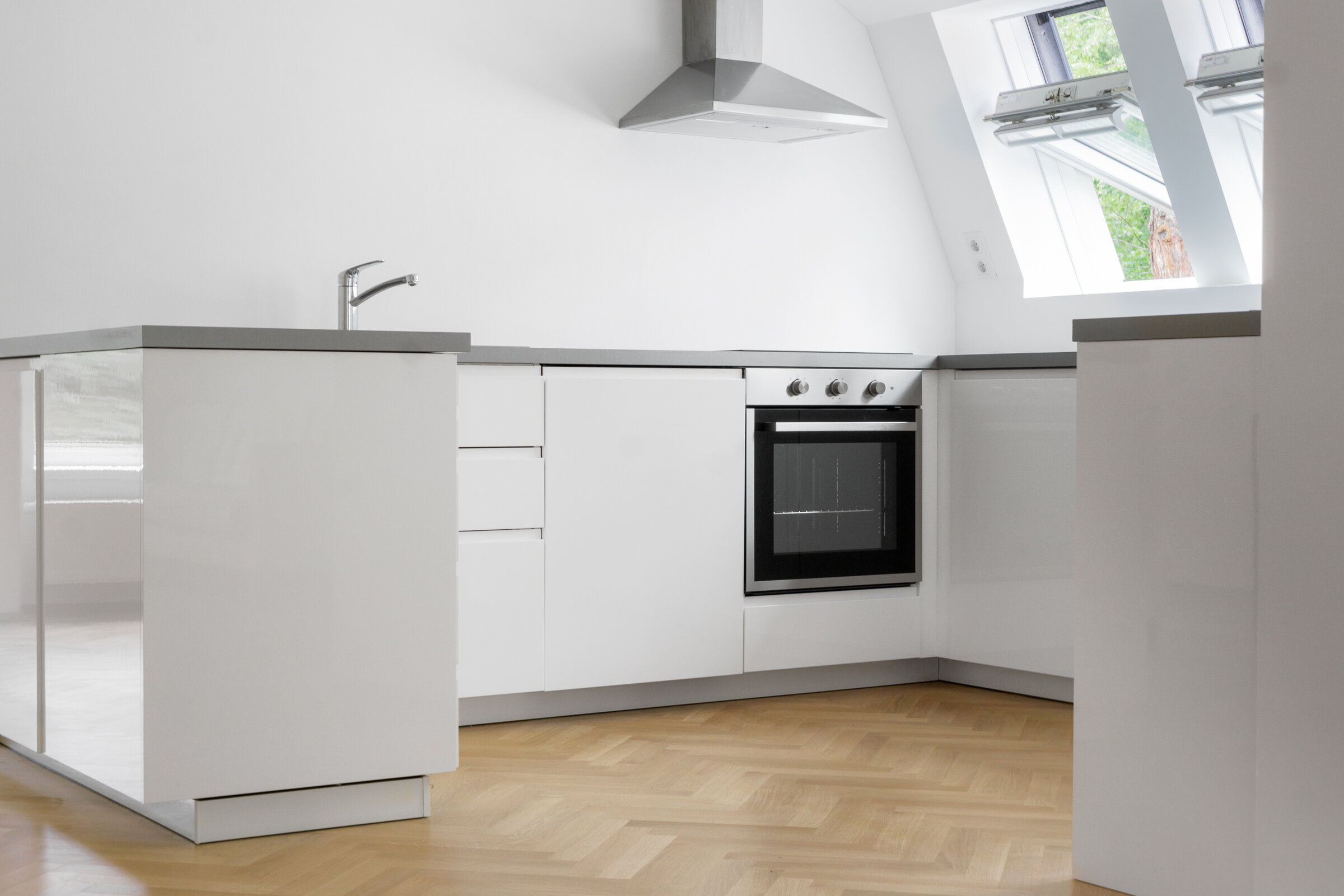 This kitchen is fully integrated into the spacious open living, working and dining area.
