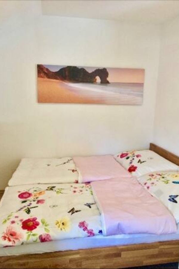 bedroom with a cozy king-size bed | © Natalie