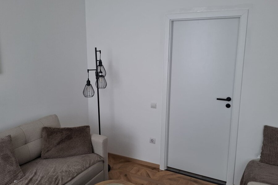 Towards the door to the kitchen/entrance hall