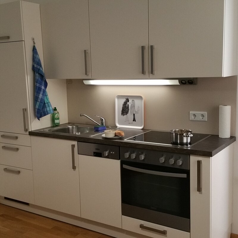 Kitchen unit with dishwasher, refrigerator, stove and oven