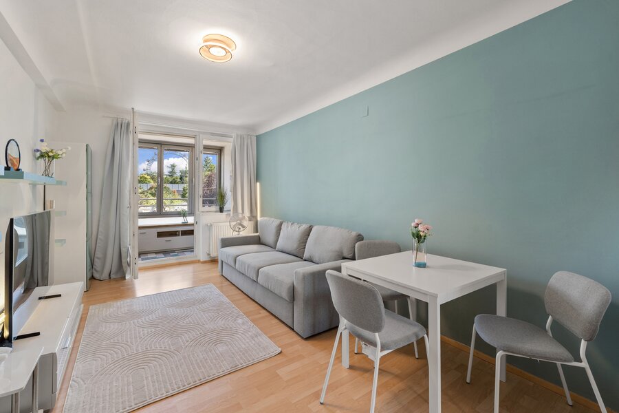 Bright living room with Ferris wheel view – 2-room apartment for short-term rental & temporary housing for 1 to 6 months in Vienna